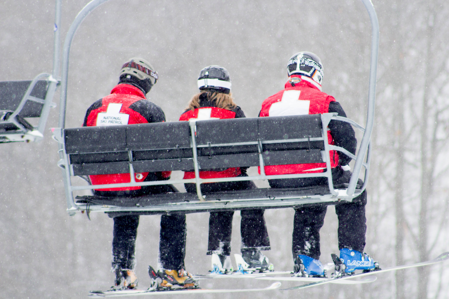 ski patrol on chairlift