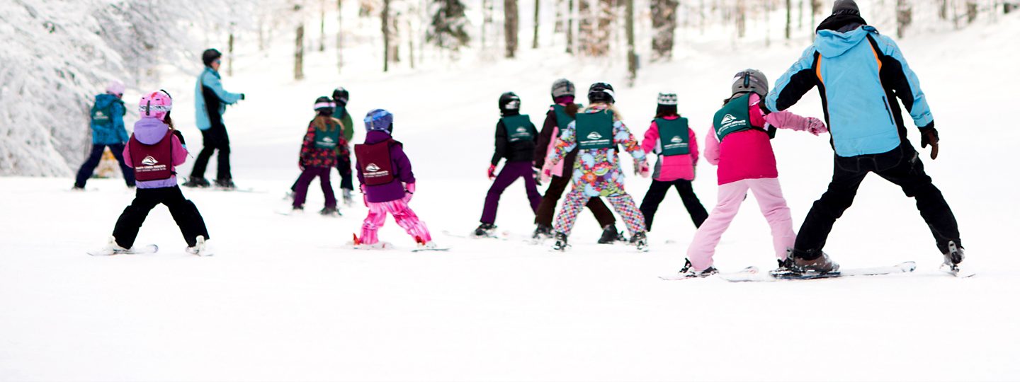 Children taking ski lessons