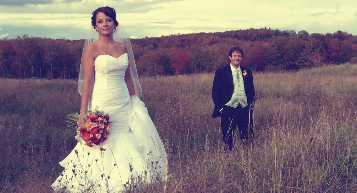 Bride and groom in a field