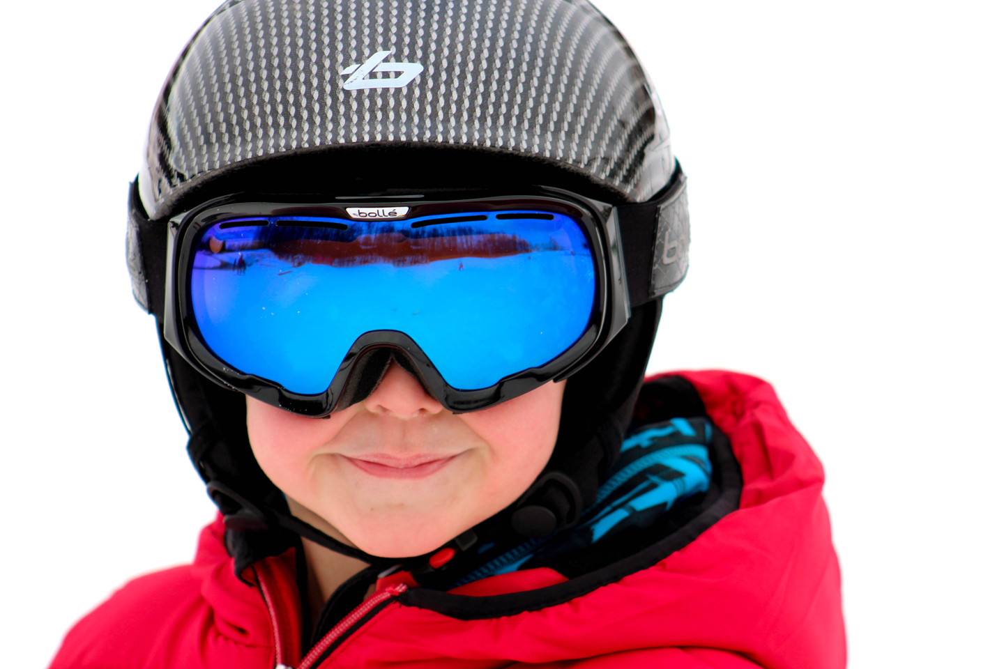little boy with helmet and goggles