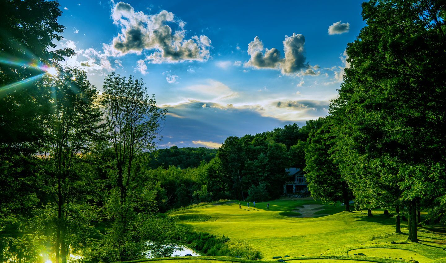 The Legend Hole 12 Green with Golfers on it