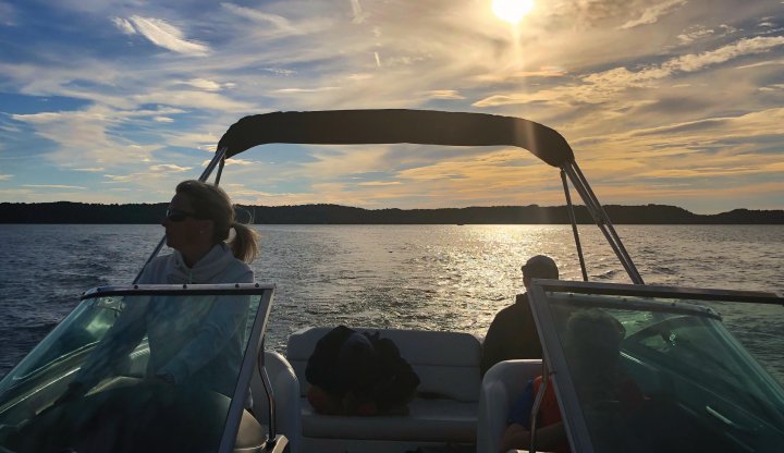 Boating on Torch Lake as the sun sets to the west