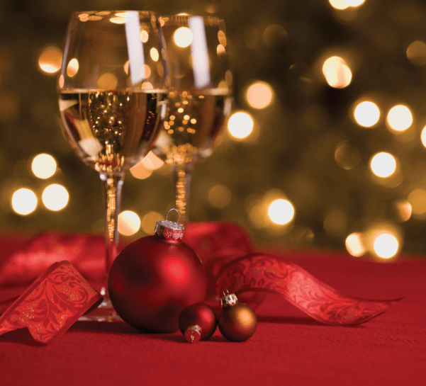 Wine and Ornaments in a Holiday Setting
