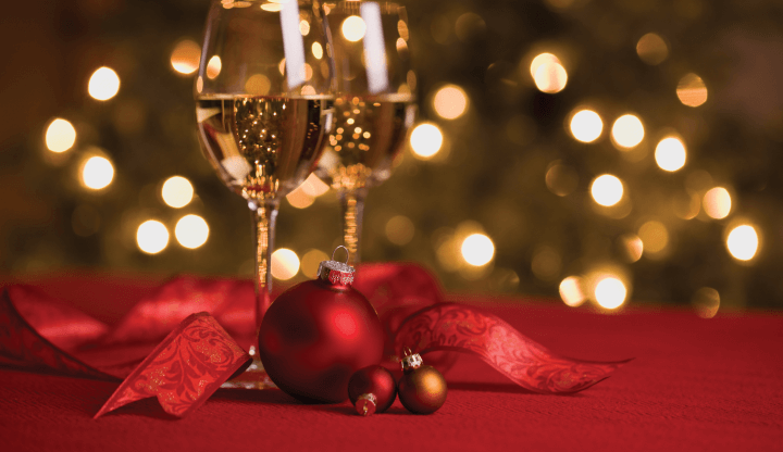 Wine and Ornaments in a Holiday Setting