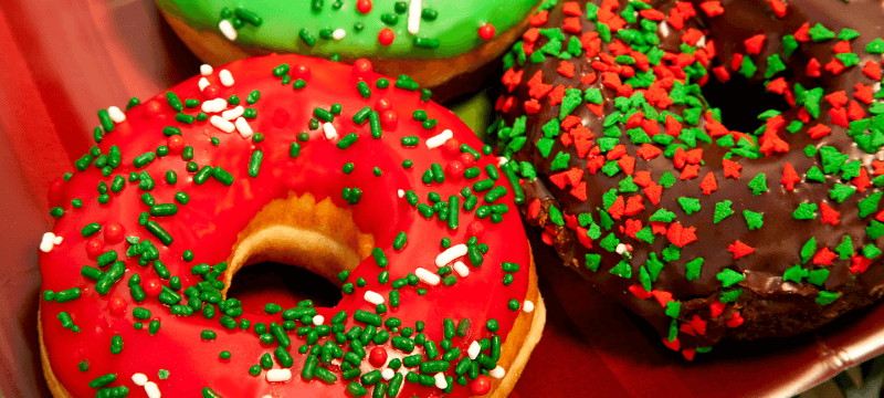 donuts with red and green holiday decorations