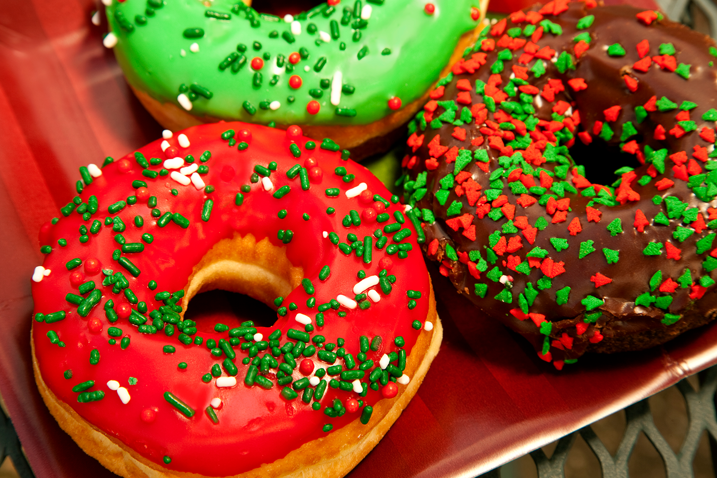 donuts with red and green holiday decorations