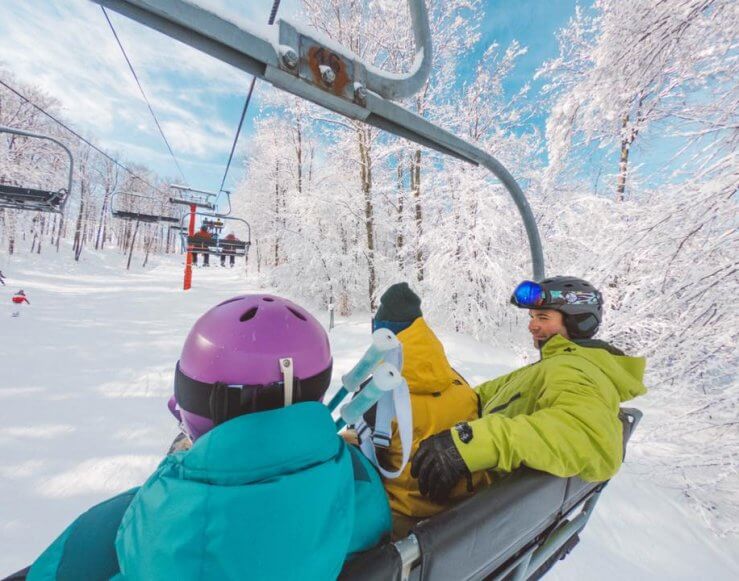 skiers on chairlift