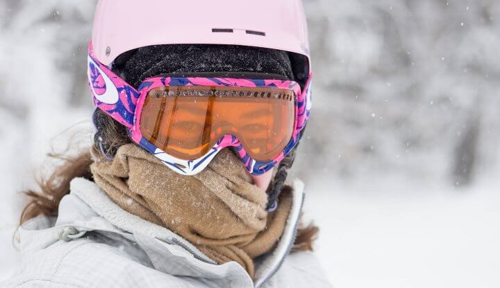 Portrait of female skier with mask