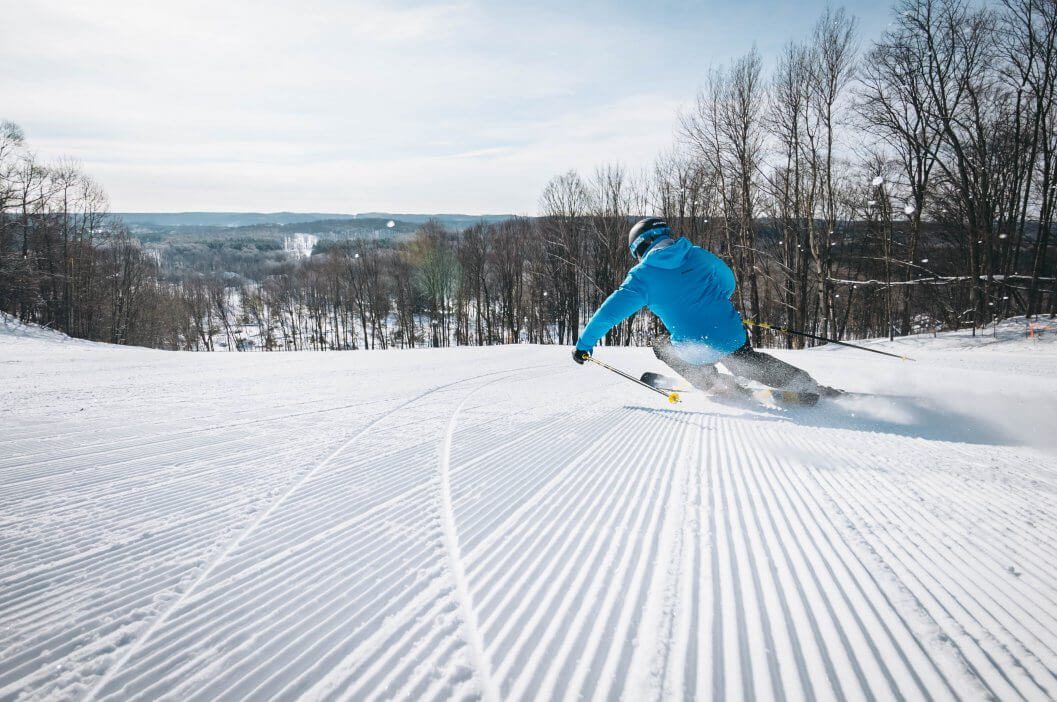 Looking at the back of a skier going down Pink Schussycat