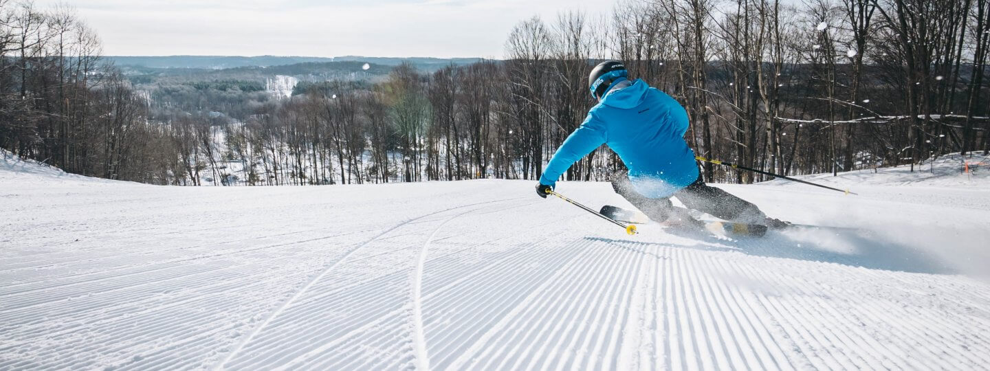 Looking at the back of a skier going down Pink Schussycat