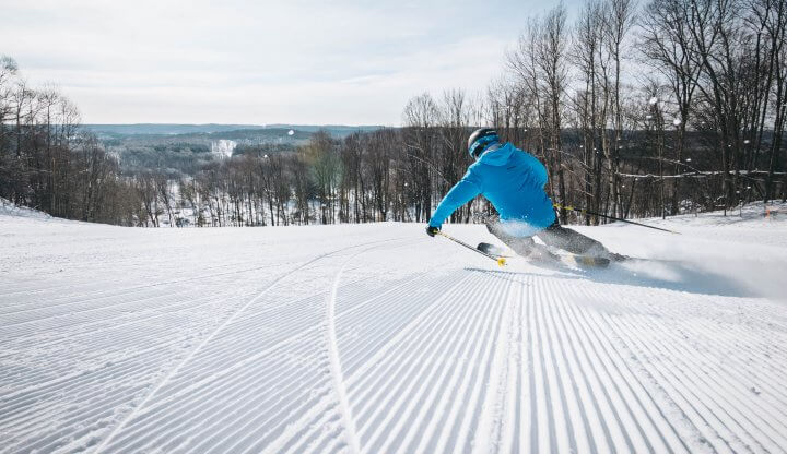 Looking at the back of a skier going down Pink Schussycat