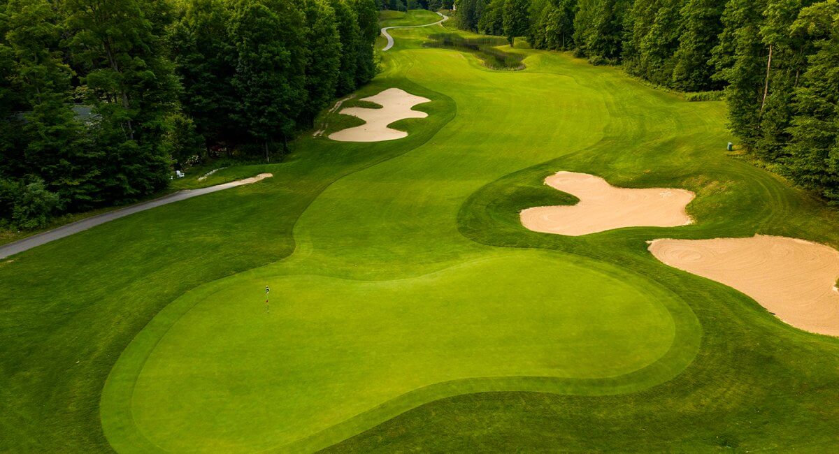 Aerial of Hawk's Eye GC's 8th green looking back at the fairway