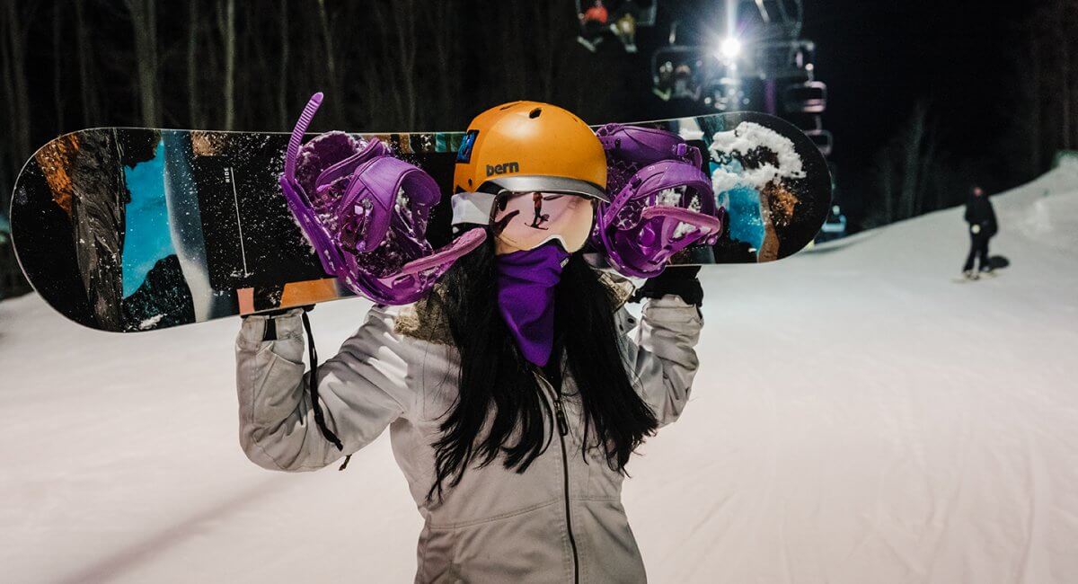 Boarder stands at the bottom on the purple lift