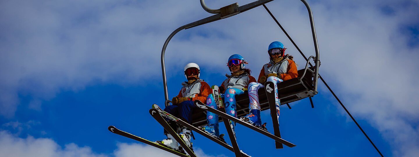 Skiers on a chairlift