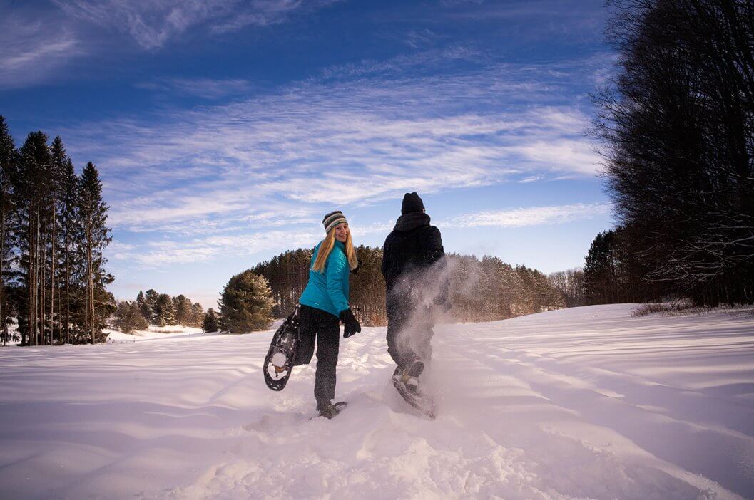 A couple snowshoeing