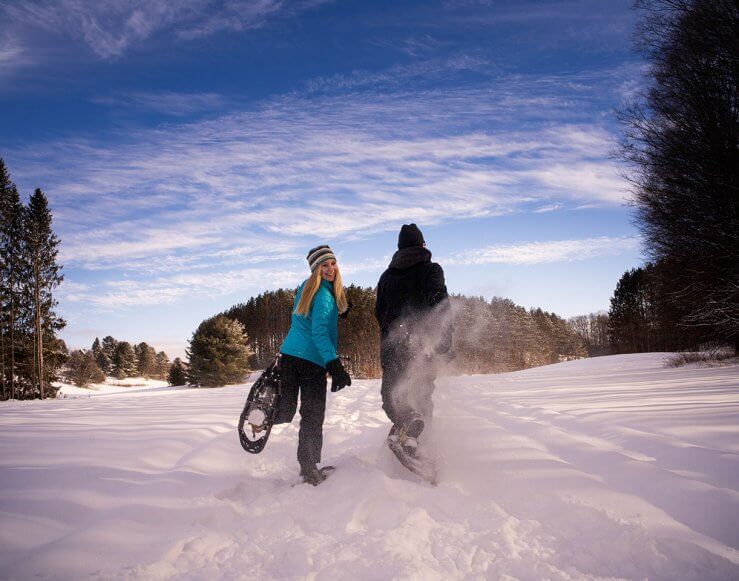 A couple snowshoeing