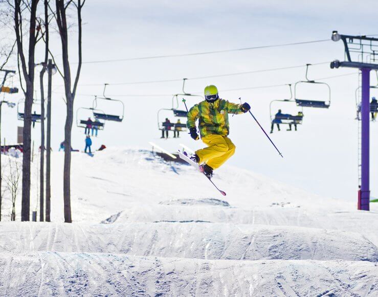 Overlooking purple daze and chairlift, terrain park and skie