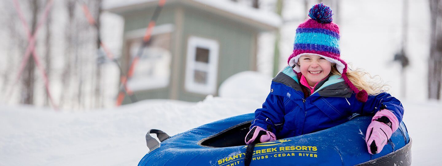 Young girl tubing