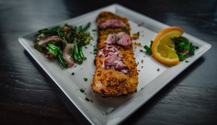 Herb Crusted Tilapia on a white square plate