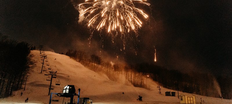 White Fireworks over Schuss Mountain at night.