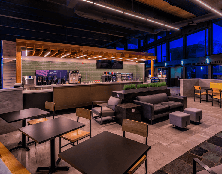 The Lakeview Hotel's CoffeeBAR with tables/seating in foreground and countertops/ordering area in background