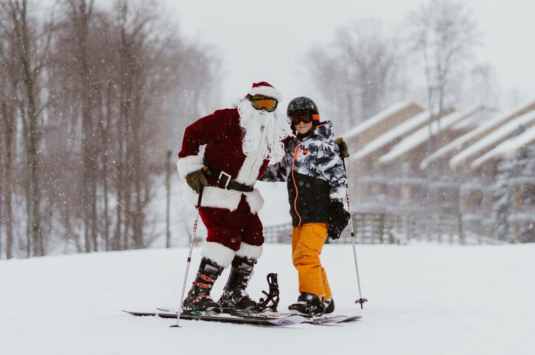 kid skiing with santa