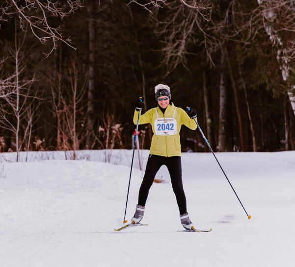 Cross Country Skiier in Yellow Coat