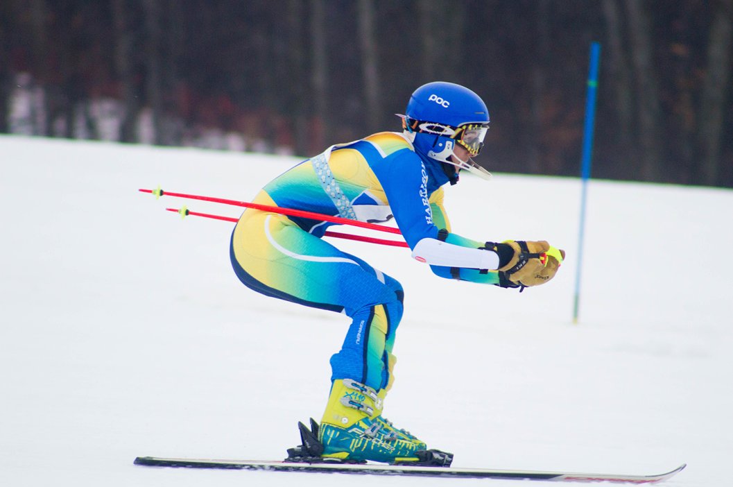 Alpine Ski Racer in Blue/Green/Yellow Speedsuit