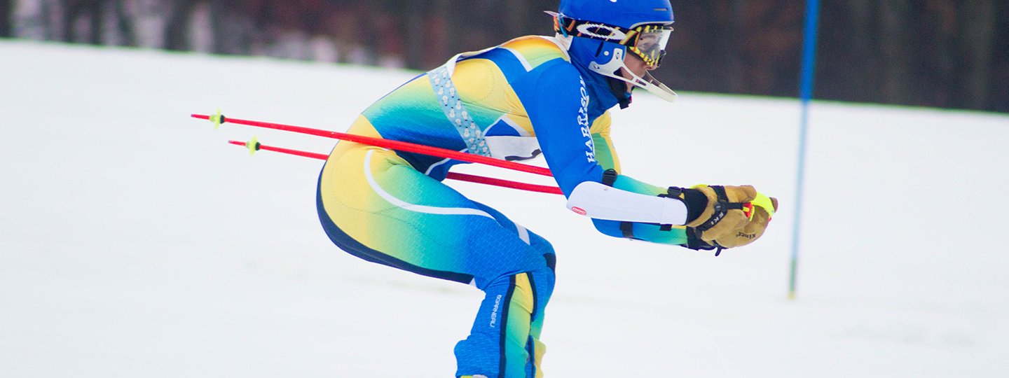 Alpine Ski Racer in Blue/Green/Yellow Speedsuit