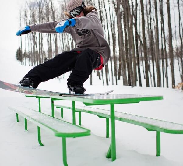 Snowboarder on Tabletop Feature in Purple Daze Terrain Park