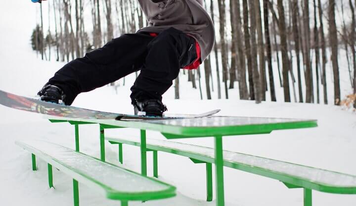 Snowboarder on Tabletop Feature in Purple Daze Terrain Park