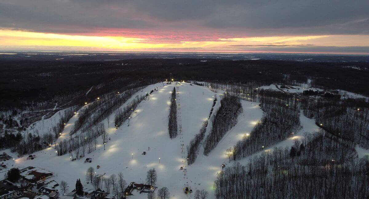Aerial of Schuss Mountain at Night with the sun setting