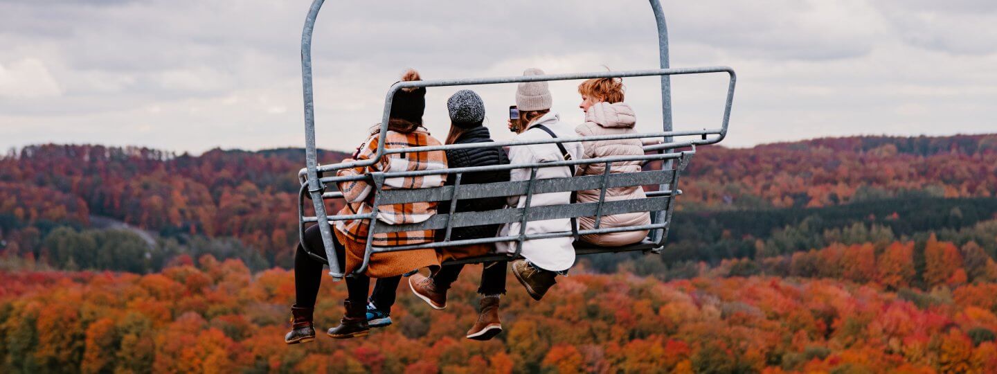 Chairlift over fall trees