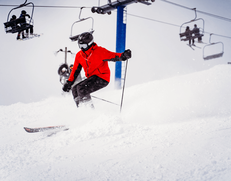 Skier schussing down Kingdom Come on Schuss Mountain's Blue Chairlift