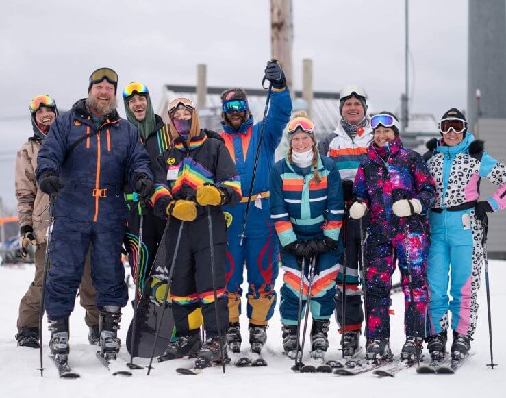 Group of Skiers at the Top of Schuss in Retro Ski Gear